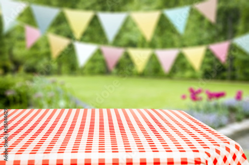 Summer background of tablecloth and garden of summer time 