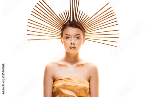 young beautiful woman with golden makeup and accessory on head looking at camera isolated on white