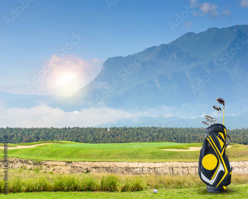 golf equipment on green and hole as background photo