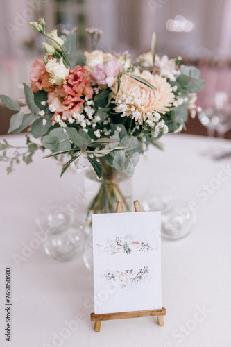 The wedding decor. The white flowers bouquet