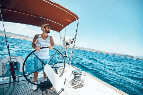 Man on a yacht enjoy on vacation. © luckybusiness