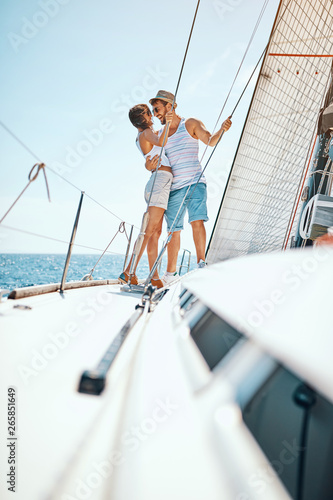 Romantic vacation and luxury travel. Man and woman enjoying on luxury boat.