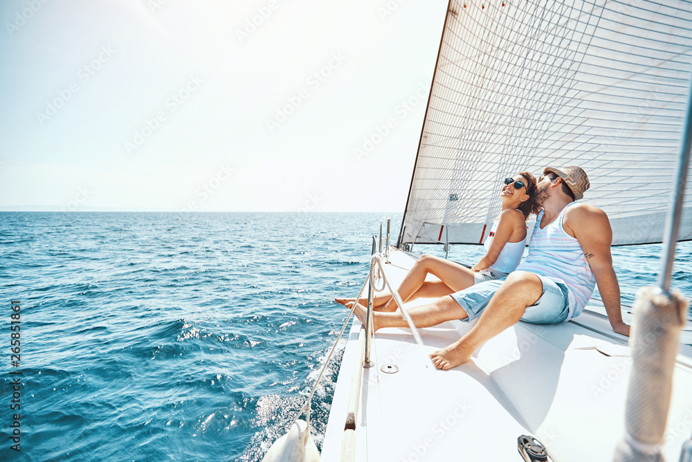 Young man and woman Relaxing on a Yacht..