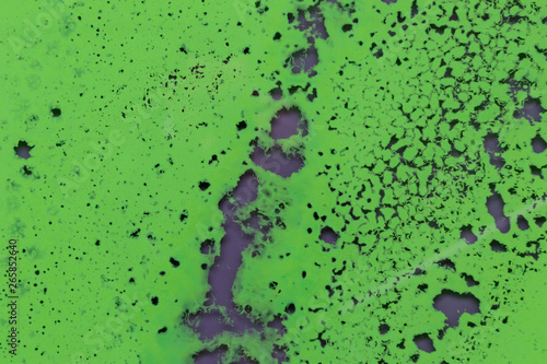 Abstrakter grüner Hintergrund mit kleinen Strukturen und grau-schwarzen Akzenten