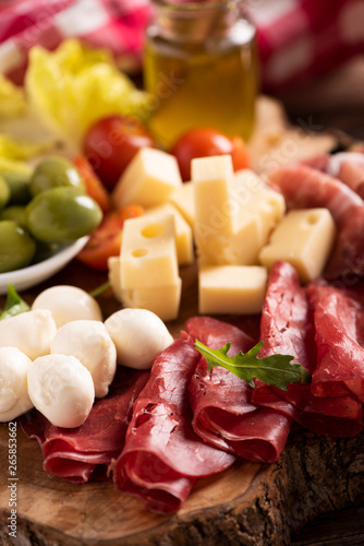 Antipasto catering platter with olives , jerky, salami and cheese