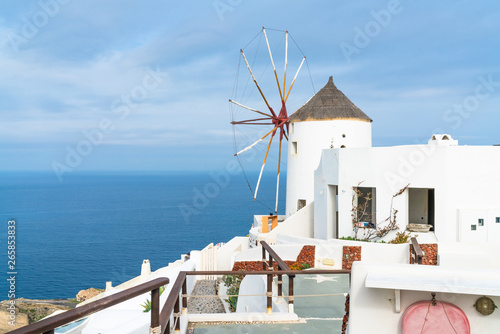 Traditional white windmill in Oia on Cyclades island of Santorini, Greece