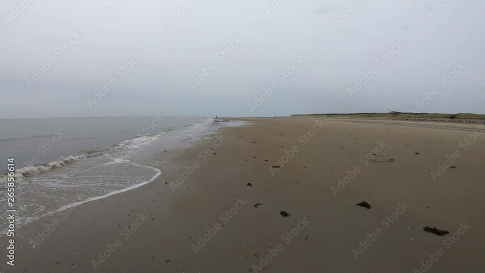 Waves crashing on the shore on a rainy day Waves crashing on the shore on a rainy day