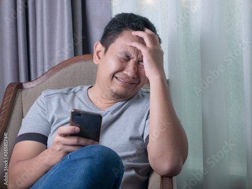 Young Man Crying To Get Bad News on Phone