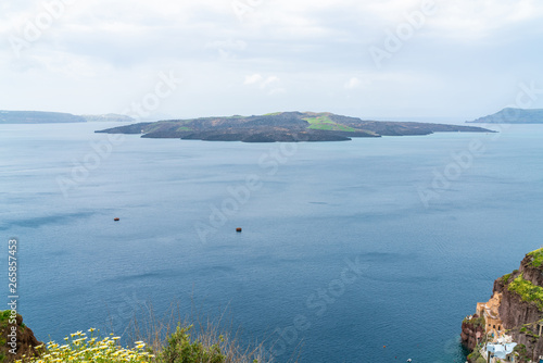 View of volcano caldera and Aegean Sea in Fira, Santorini landscape, Greece photo