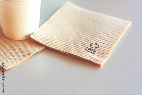 Disposable napkin made from recycled paper. photo
