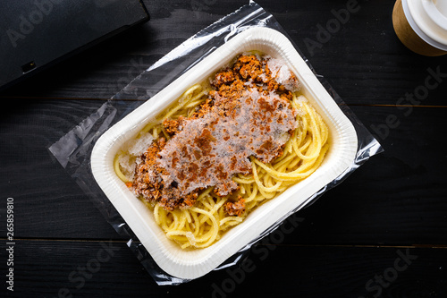 office lunch, frozen spaghetti bolognese on the table
