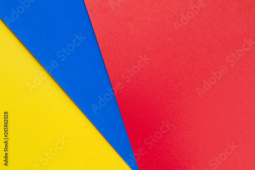 Yellow blue and red papers background.Concept of primary colors