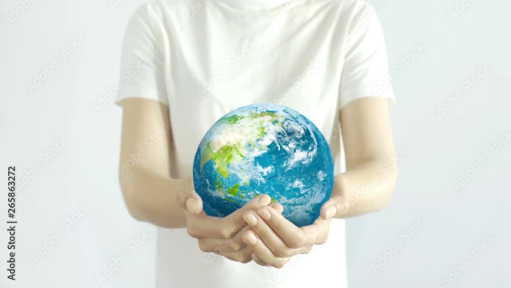 Woman holding the Planet in hands. Young adult hands holding the globe on white background. Conservation concept. Woman holding the Planet in hands. Young adult hands holding the globe on white background. Conservation concept.