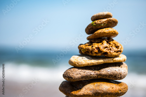 Photo cairn on sea background. pyramid