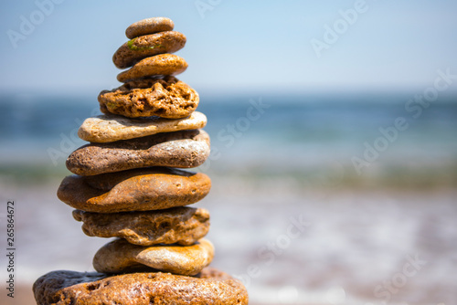 Photo cairn on sea background. pyramid