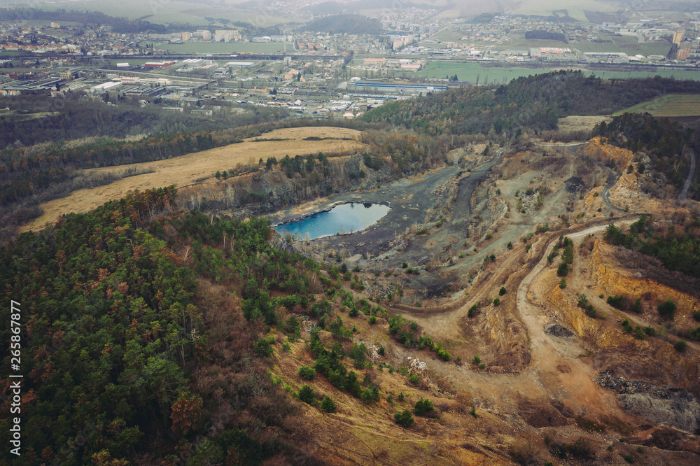 The quarry was opened in 1918 and gradually expanded throughout the 20th century by joining the surrounding smaller quarries. It belonged to Skoda factories, which used to extract limestone here.