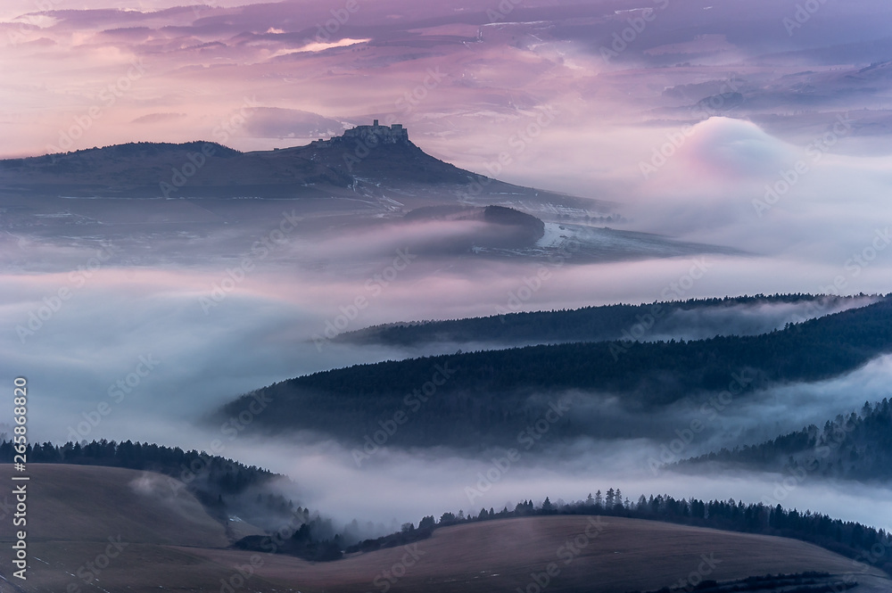 Unique Spis (Spiš, Spišský) castle in the mist. Second biggest castle in Middle Europe, Unesco Wold Heritage, Slovakia