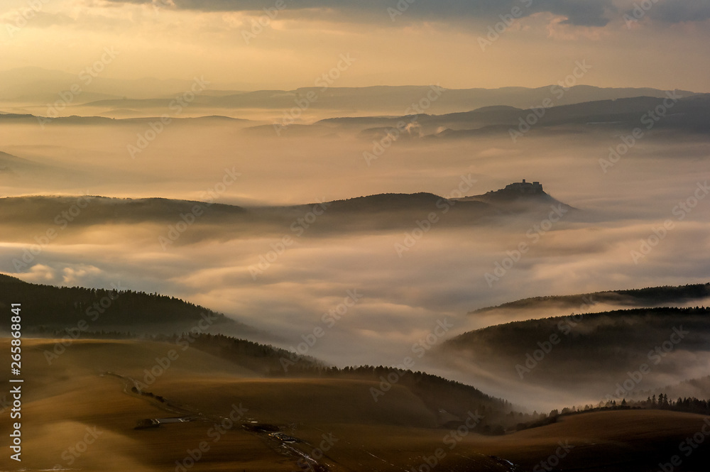 Unique Spis (Spiš, Spišský) castle in the mist. Second biggest castle in Middle Europe, Unesco Wold Heritage, Slovakia