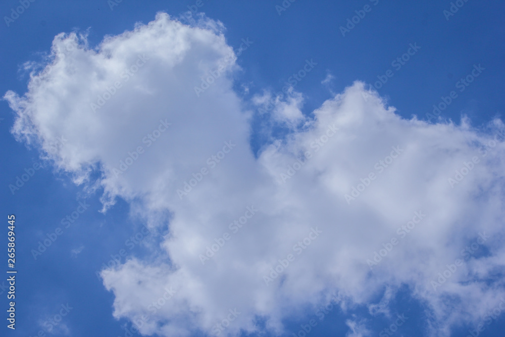 Cumulus fluffy cloud in sky during afternoon.