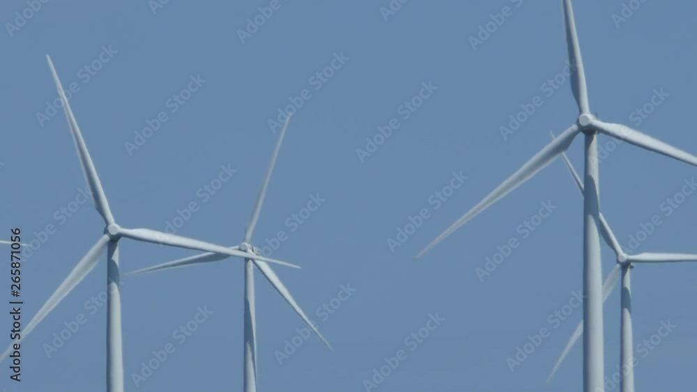 wind turbine against blue sky wind turbine against blue sky