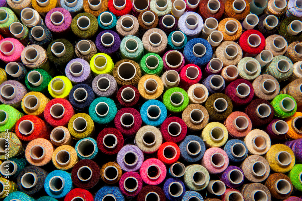Multicolored Bobbin of thread. top view. Multicolored Bobbin of thread. top view.