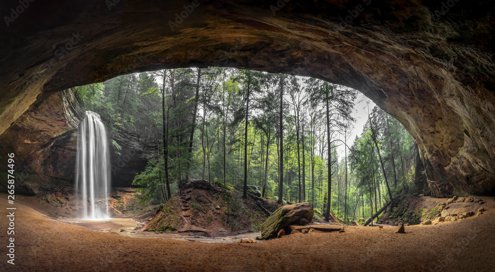 Inside Ash Cave Panorama - Located in the Hocking Hills of Ohio, Ash Cave is an enormous sandstone recess cave adorned with a beautiful waterfall after spring rains. - obrazy, fototapety, plakaty 