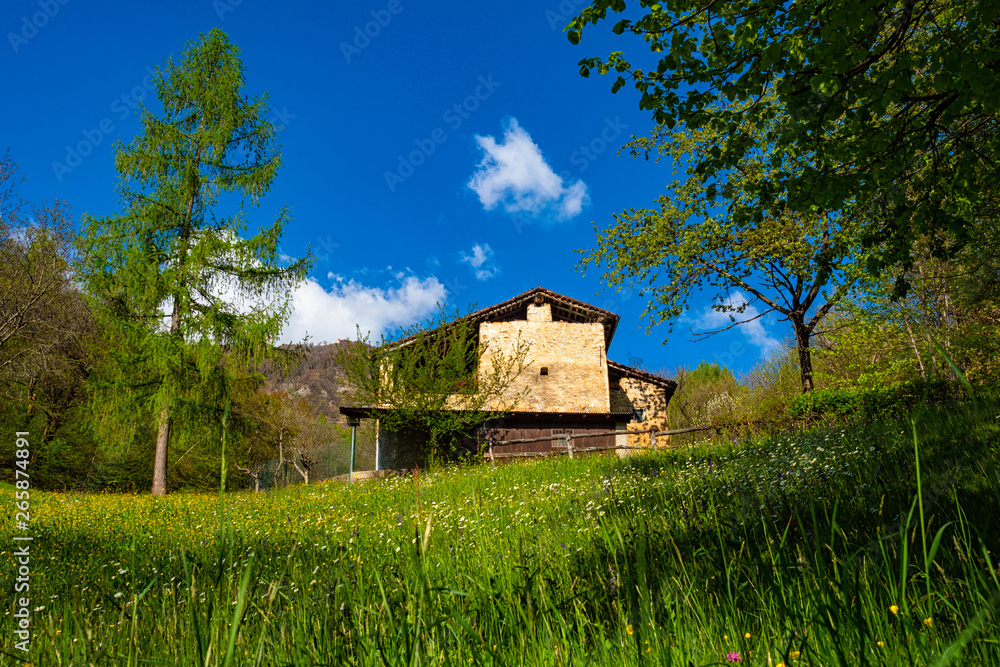 Old house in a prairie of the alps Old house in a prairie of the alps