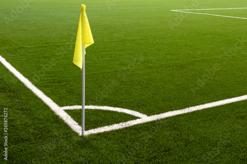 Obraz na plátně Yellow flag on the corner of a football field