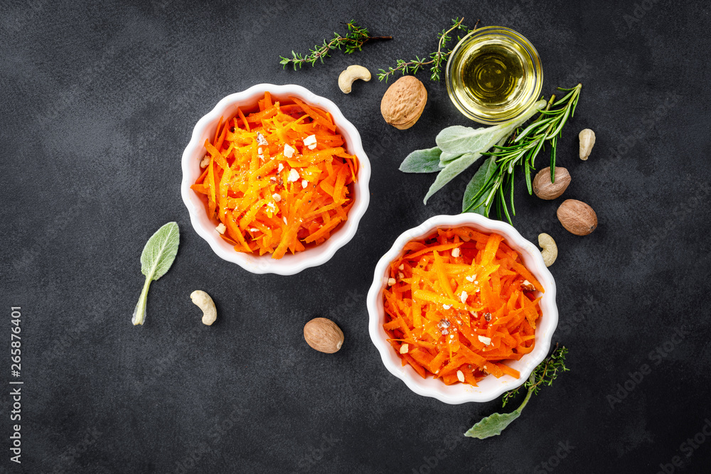 Fresh carrot salad with oil and nuts Fresh carrot salad with oil and nuts