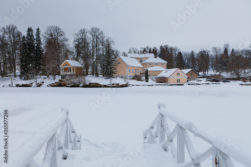 An old manor house Vihula in Estonia, Lahemaa park. Beautiful winter views with bridges and frozen ponds.