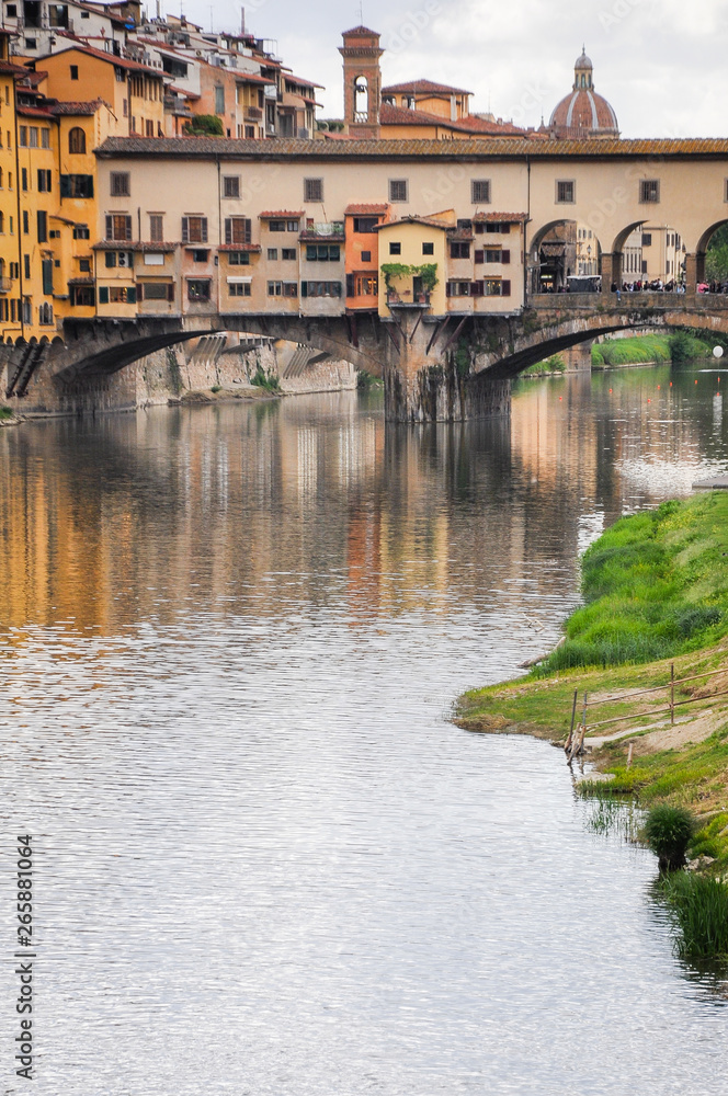 Ponte Vecchio or Old Bridge is a medieval stone bridge over the Arno River, in Florence, Italy. It's noted for having shops on in. Photos taken right after the rain as the sun was coming out.