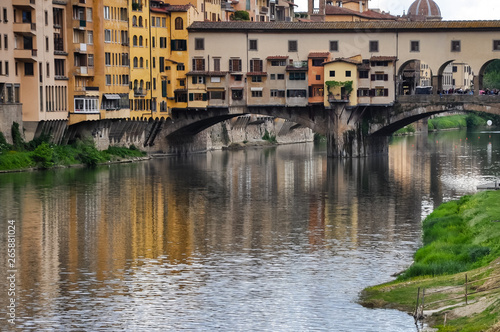 Ponte Vecchio or Old Bridge is a medieval stone bridge over the Arno River, in Florence, Italy. It's noted for having shops on in. Photos taken right after the rain as the sun was coming out. © Levi
