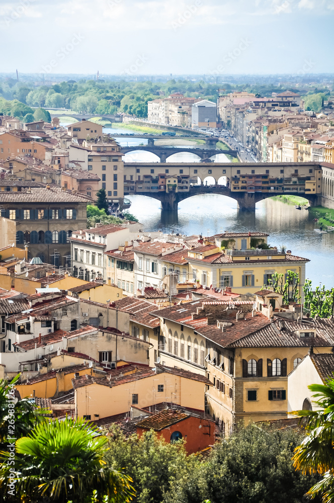 Ponte Vecchio or Old Bridge is a medieval stone bridge over the Arno River, in Florence, Italy. It's noted for having shops on in. Photos taken right after the rain as the sun was coming out.