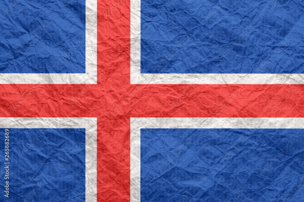Fototapeta premium Iceland flag on old crumpled craft paper.