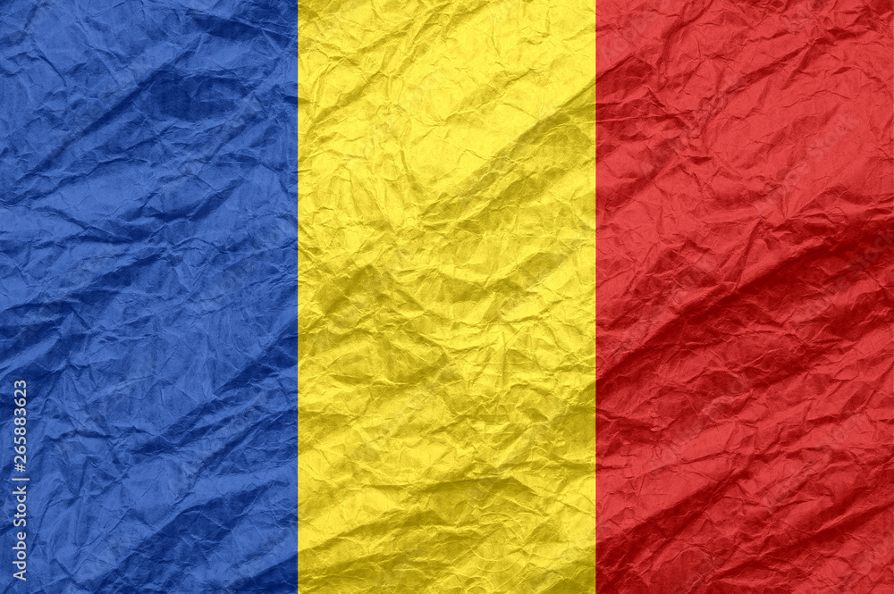 Romania flag on old crumpled craft paper.