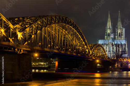 dom of cologne and hohenzollern bridge at night
