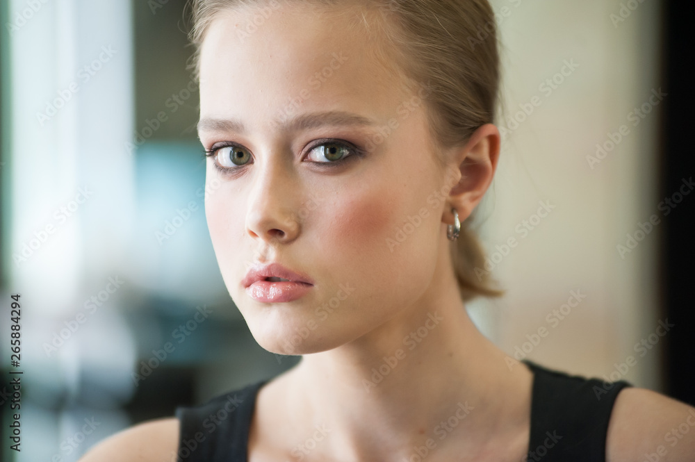 Close up portrait of beautiful young blonde woman