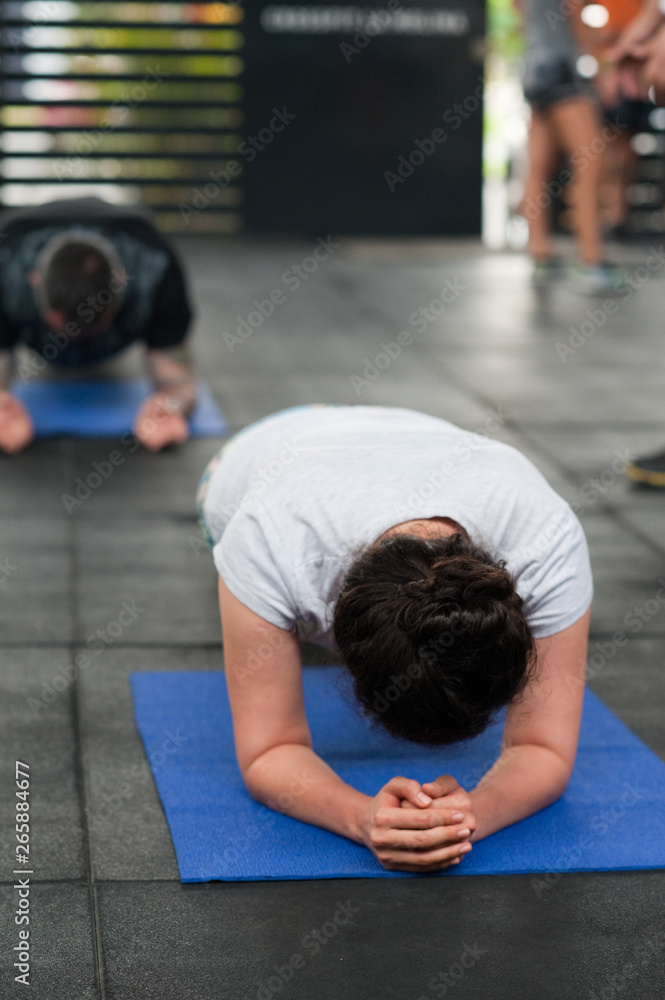 Fototapeta premium Gym members doing plank exercise