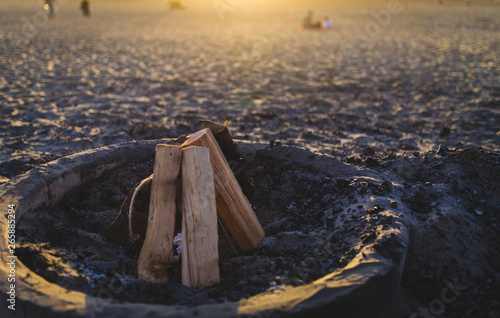Fire pit with wood on beach
