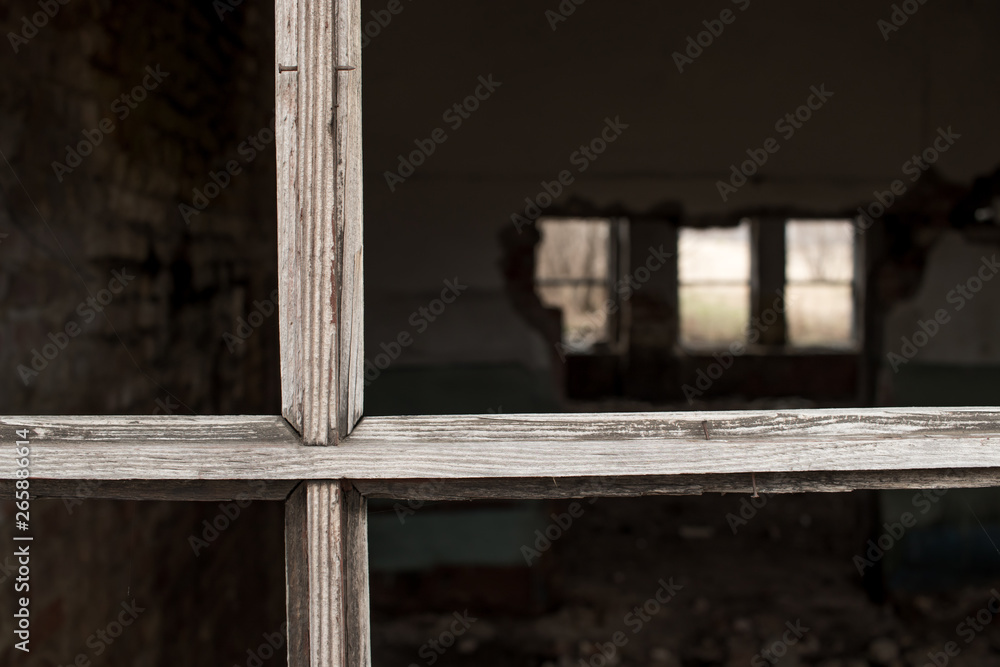 an old wooden window frame without glass in an abandoned old house an old wooden window frame without glass in an abandoned old house