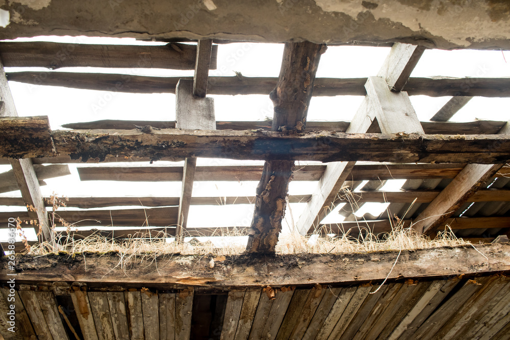 view of the remaining ceiling that collapses in an old abandoned building view of the remaining ceiling that collapses in an old abandoned building
