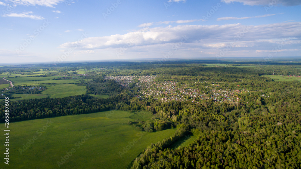 Fototapeta premium fields, forests, sky with clouds view from above