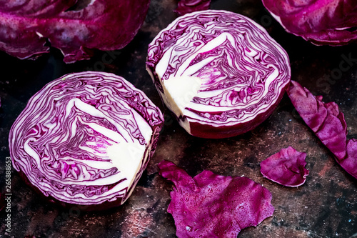 A raw round red cabbage, cut across the middle. photo