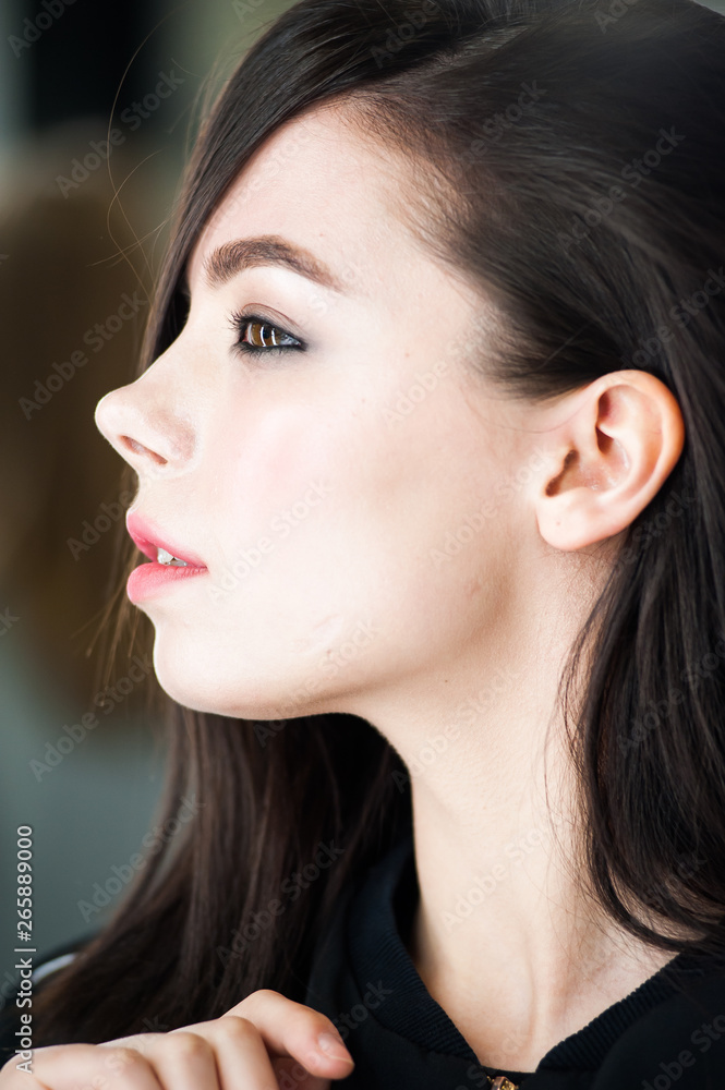 Fototapeta premium Close up portrait of beautiful young brunette woman 
