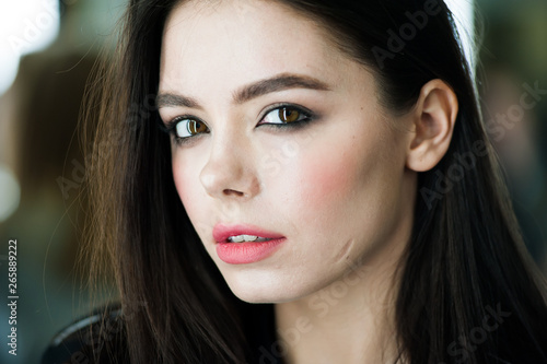 Close up portrait of beautiful young brunette woman 