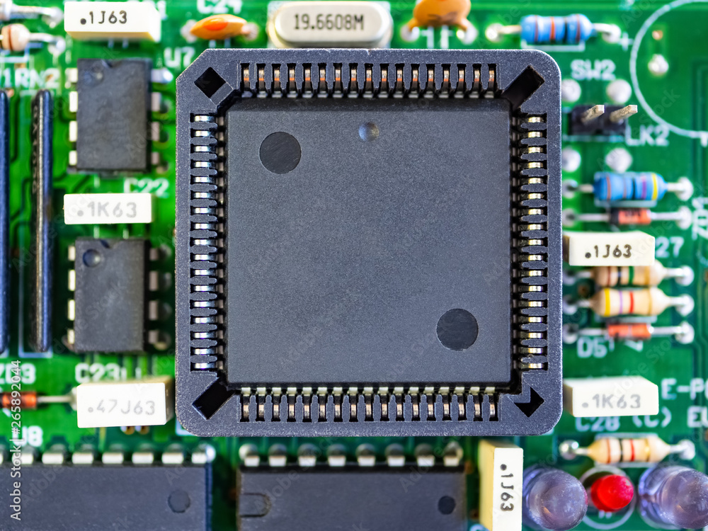 Close-up of printed electronic circuit board with processor and many integrated electrical components. Nanotechnology hardware system. Modern digital science concept. CPU welding or assembled on PCB. Close-up of printed electronic circuit board with processor and many integrated electrical components. Nanotechnology hardware system. Modern digital science concept. CPU welding or assembled on PCB.