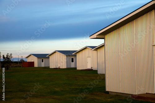 group of modern simple metal buildings at sunrise in Iceland