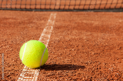 Tennis ball with racket on court  © busra