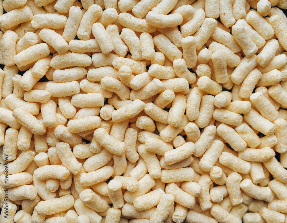 Background of yellow corn sticks. The view from the top. Dietary breakfast. Background of yellow corn sticks. The view from the top. Dietary breakfast.