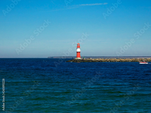 The red lighthouse at the harbor entrance